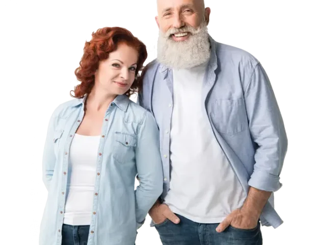 Happy senior couple during home hearing aid fitting session in London.